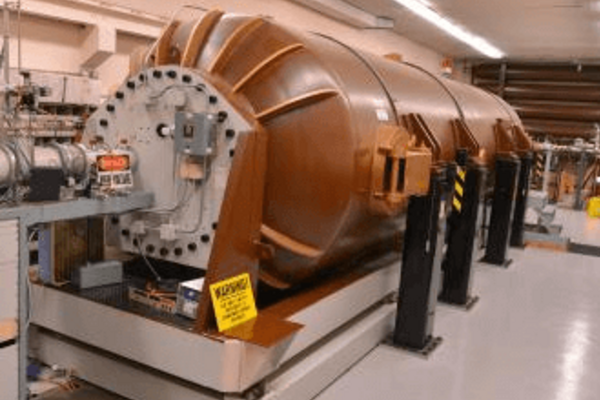 Large, copper-colored accelerator on a platform in a lab at WMU.